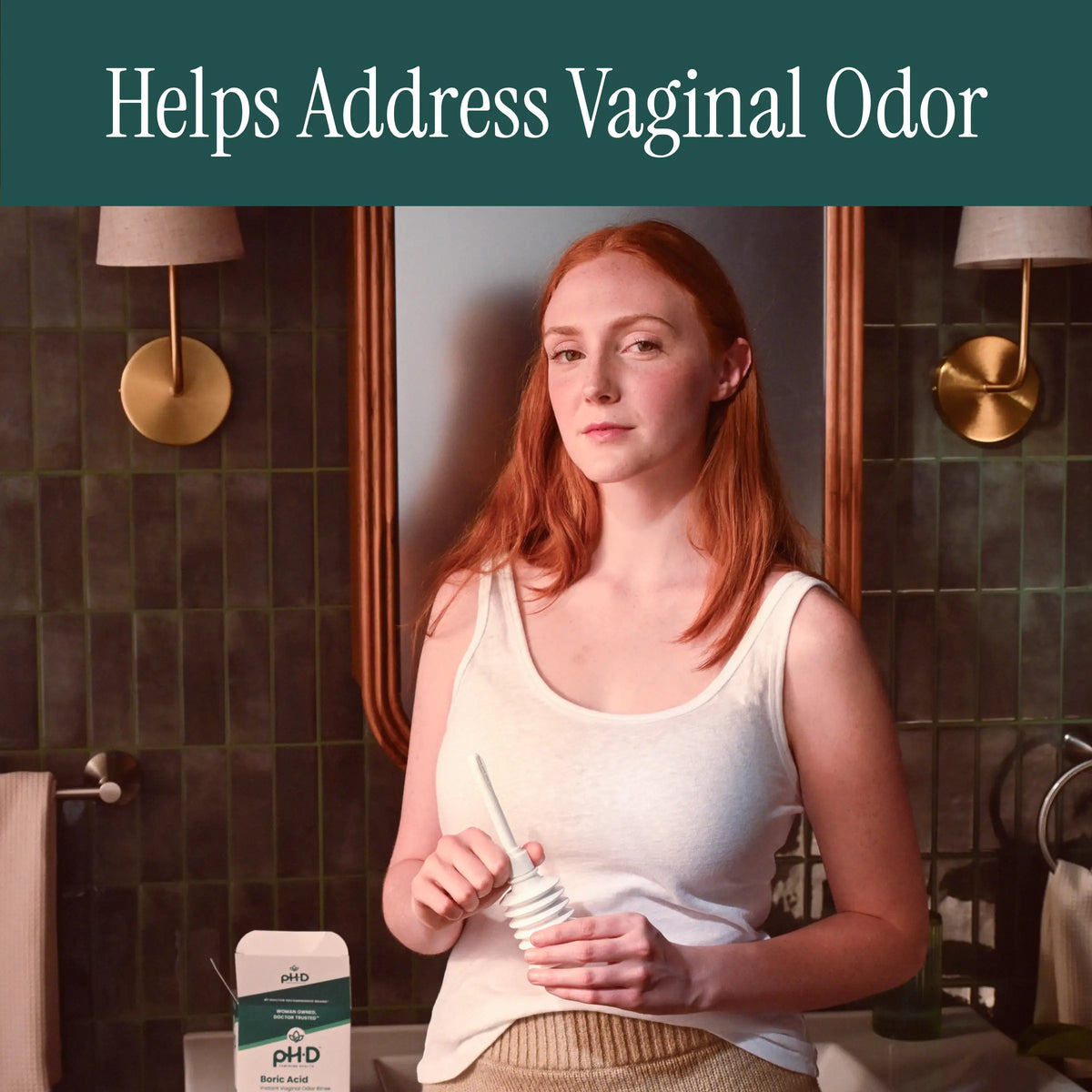 Woman holding pH-D Boric Acid Instant Odor Rinse.