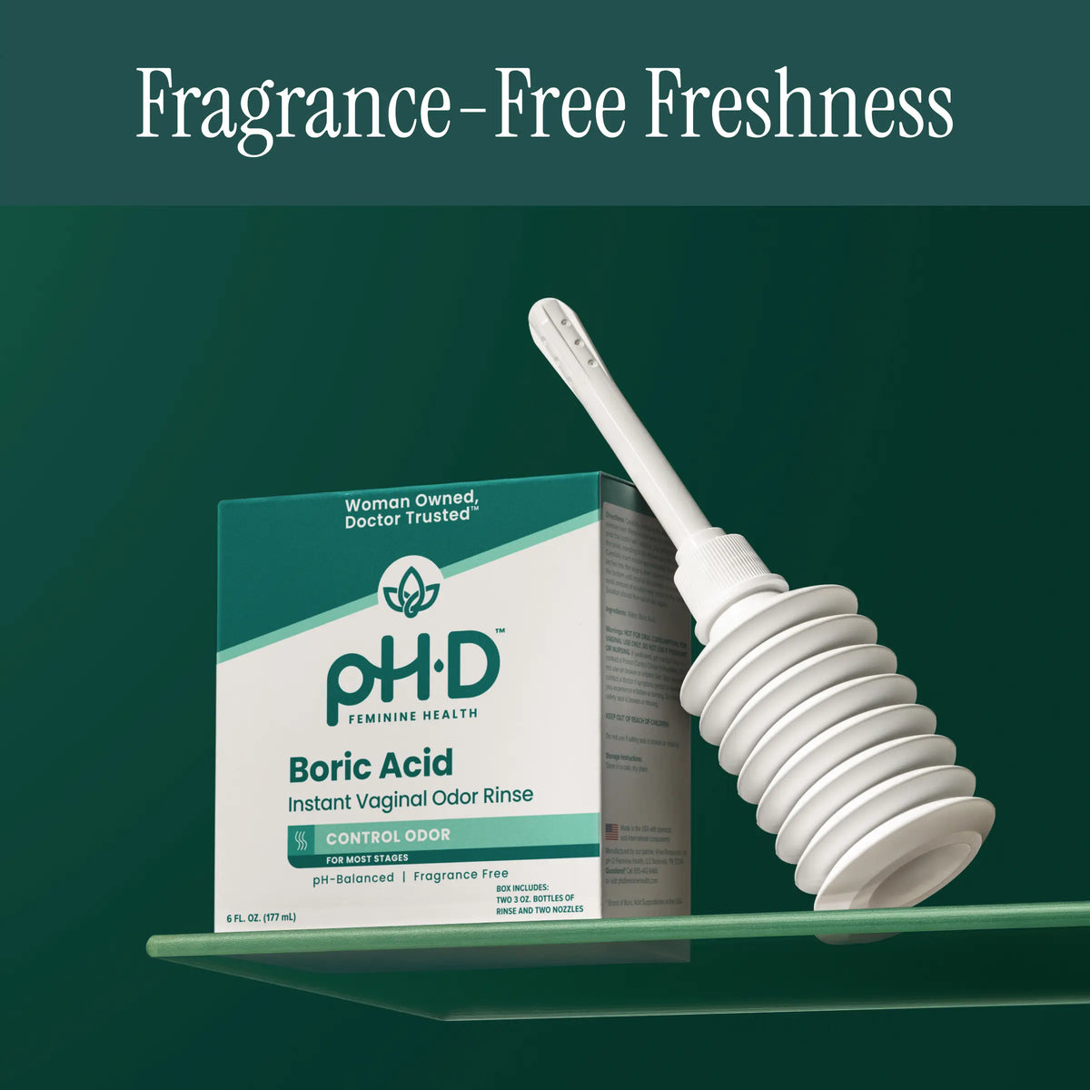 pH-D Boric Acid instant vaginal odor rinse shown with its teal and white product box and a white silicone applicator on a green gradient background. Text at the top reads 'Fragrance-Free Freshness.