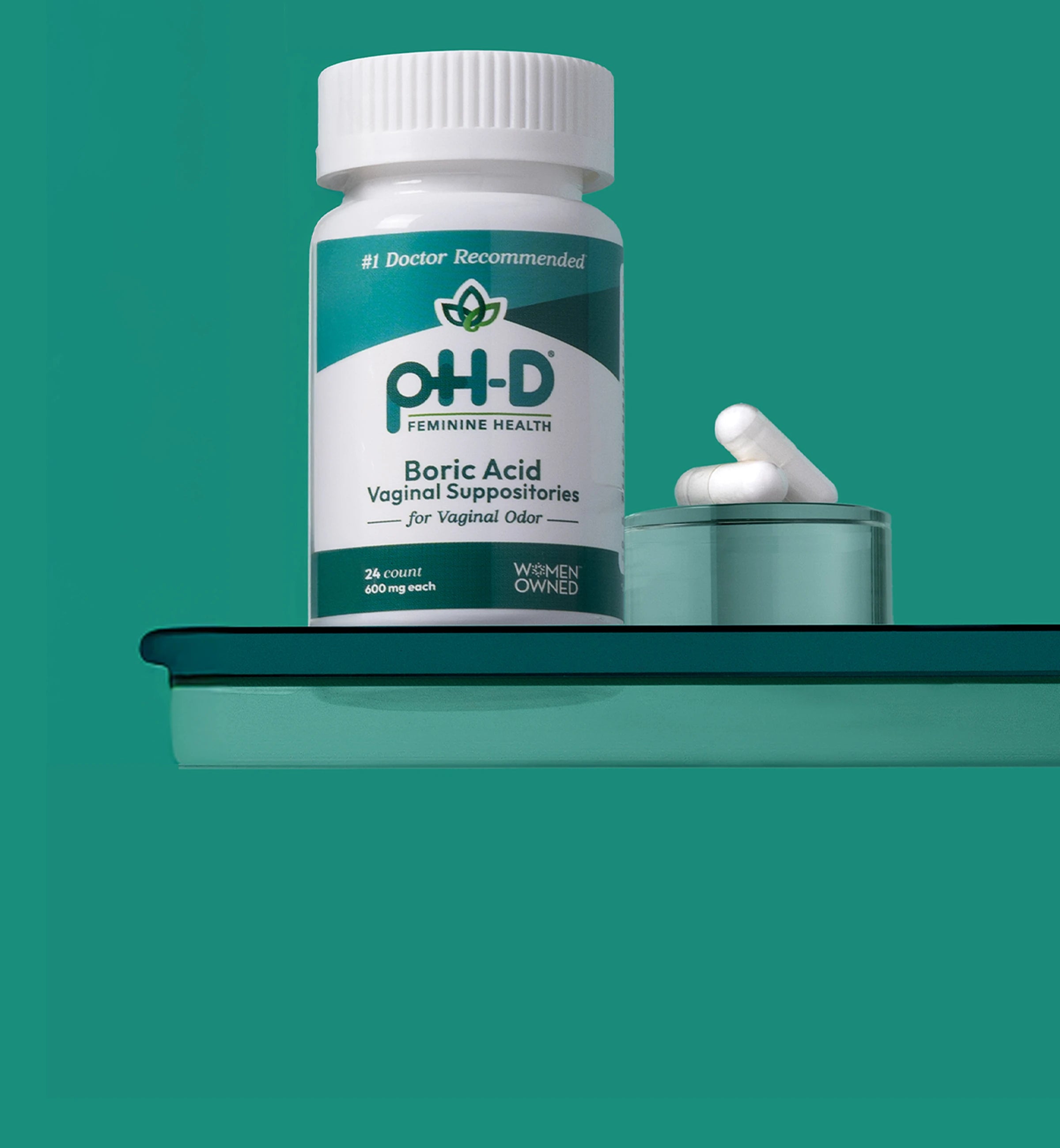 Bottle of PH-D Feminine Health Boric Acid Vaginal Suppositories on a green background