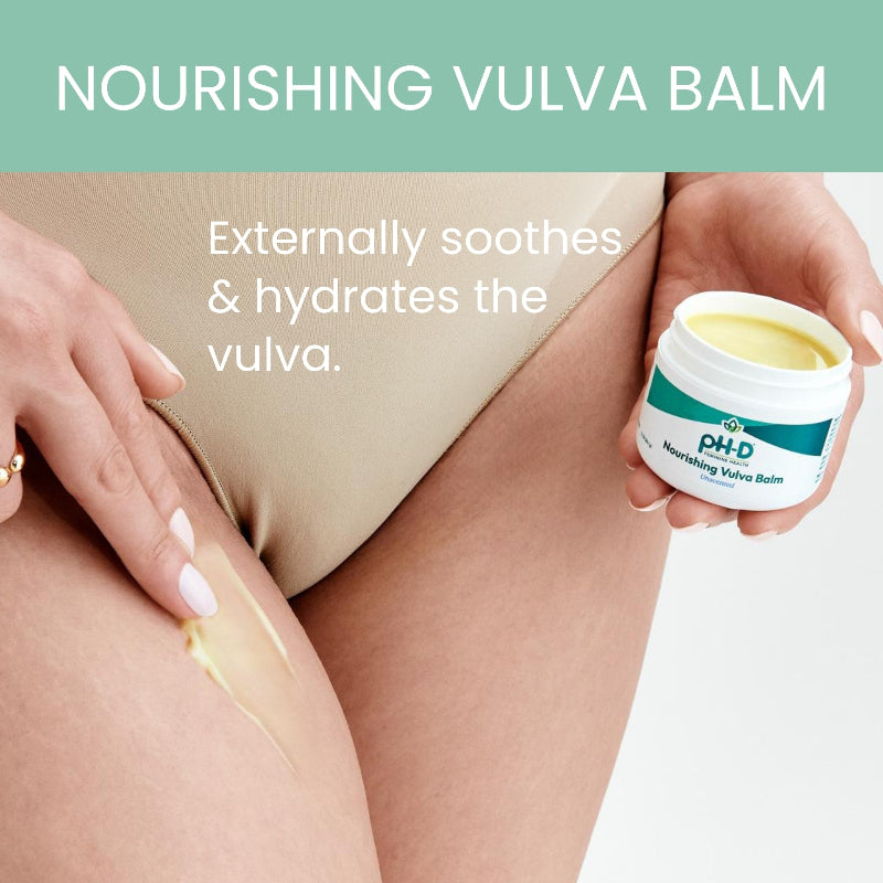 Person applying nourishing vulva balm to their leg with a container of the product visible.