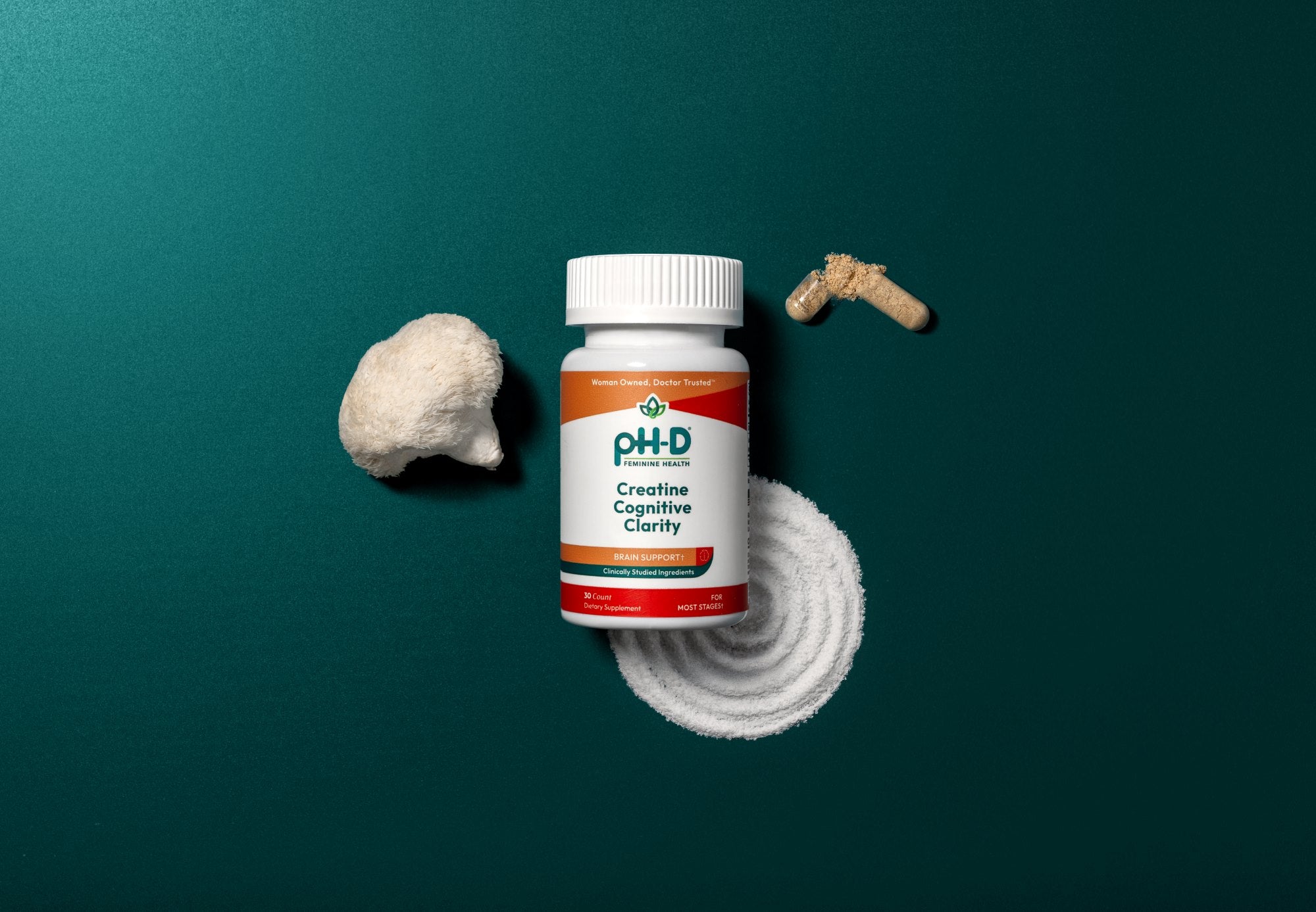 pH-D Creatine Cognitive Clarity bottle with creatine and lion's mane ingredients green background